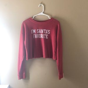 A red “Santa’s favorite” sweater